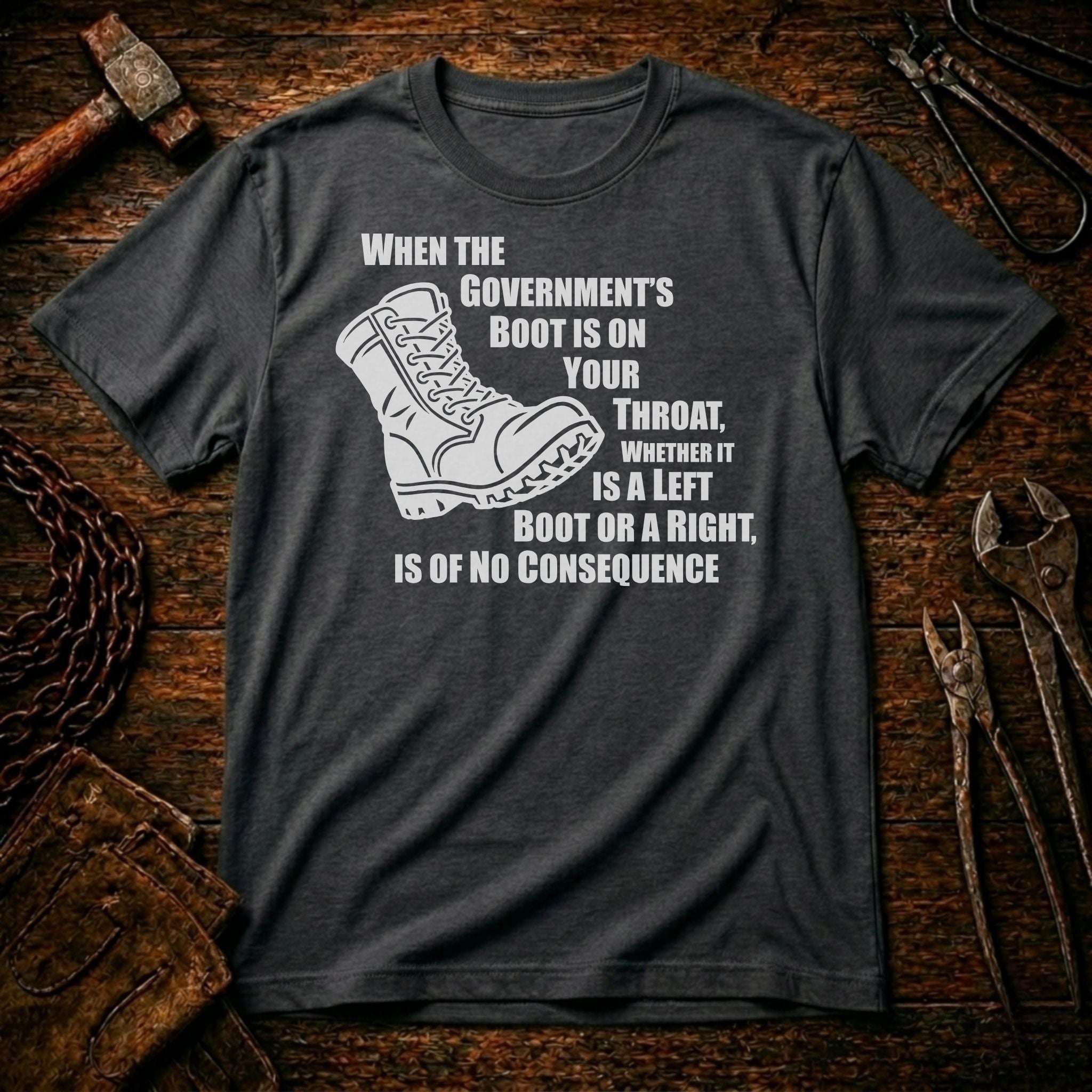Gray t-shirt with a graphic of a boot and text on a wooden background