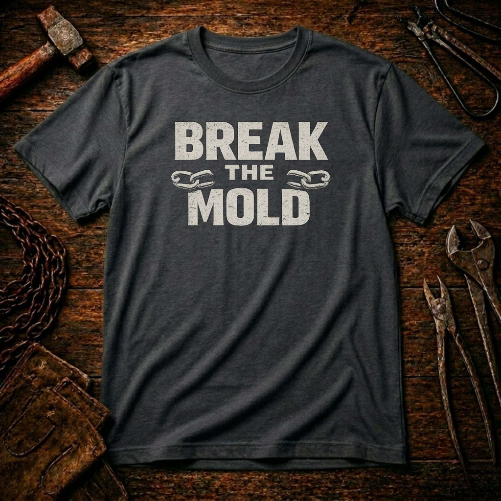 Gray t-shirt with 'Break The Mold' text on a rustic wooden background