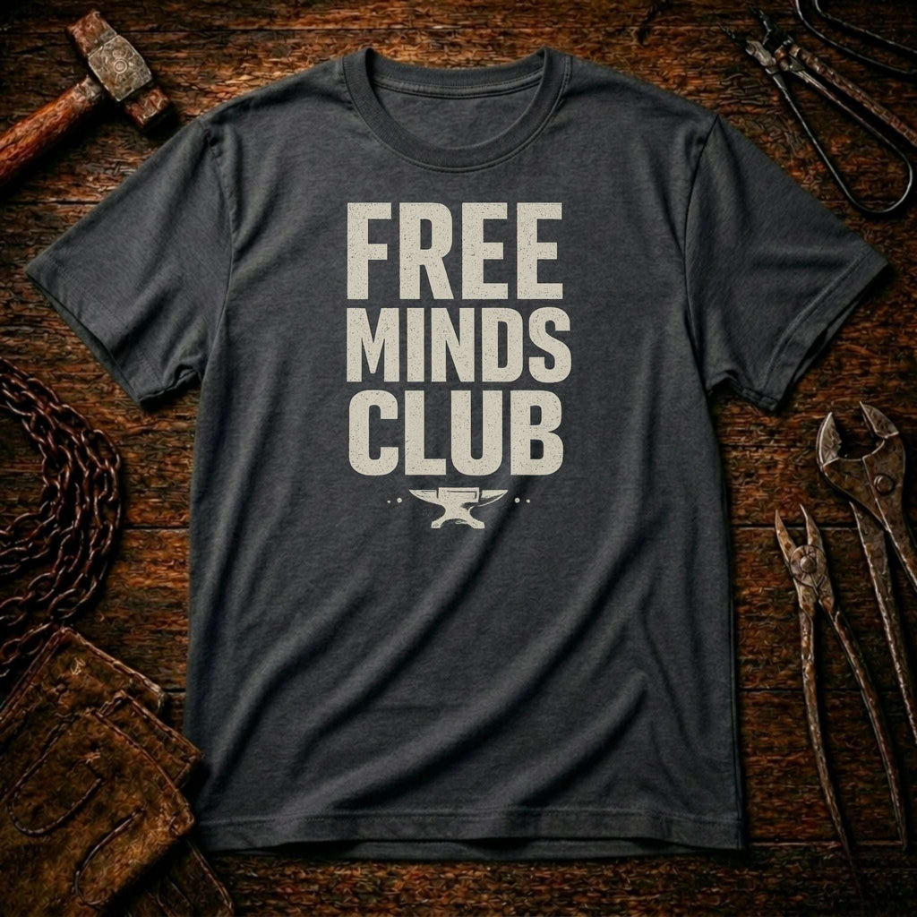 Gray t-shirt with 'FREE MINDS CLUB' text on a rustic wooden background